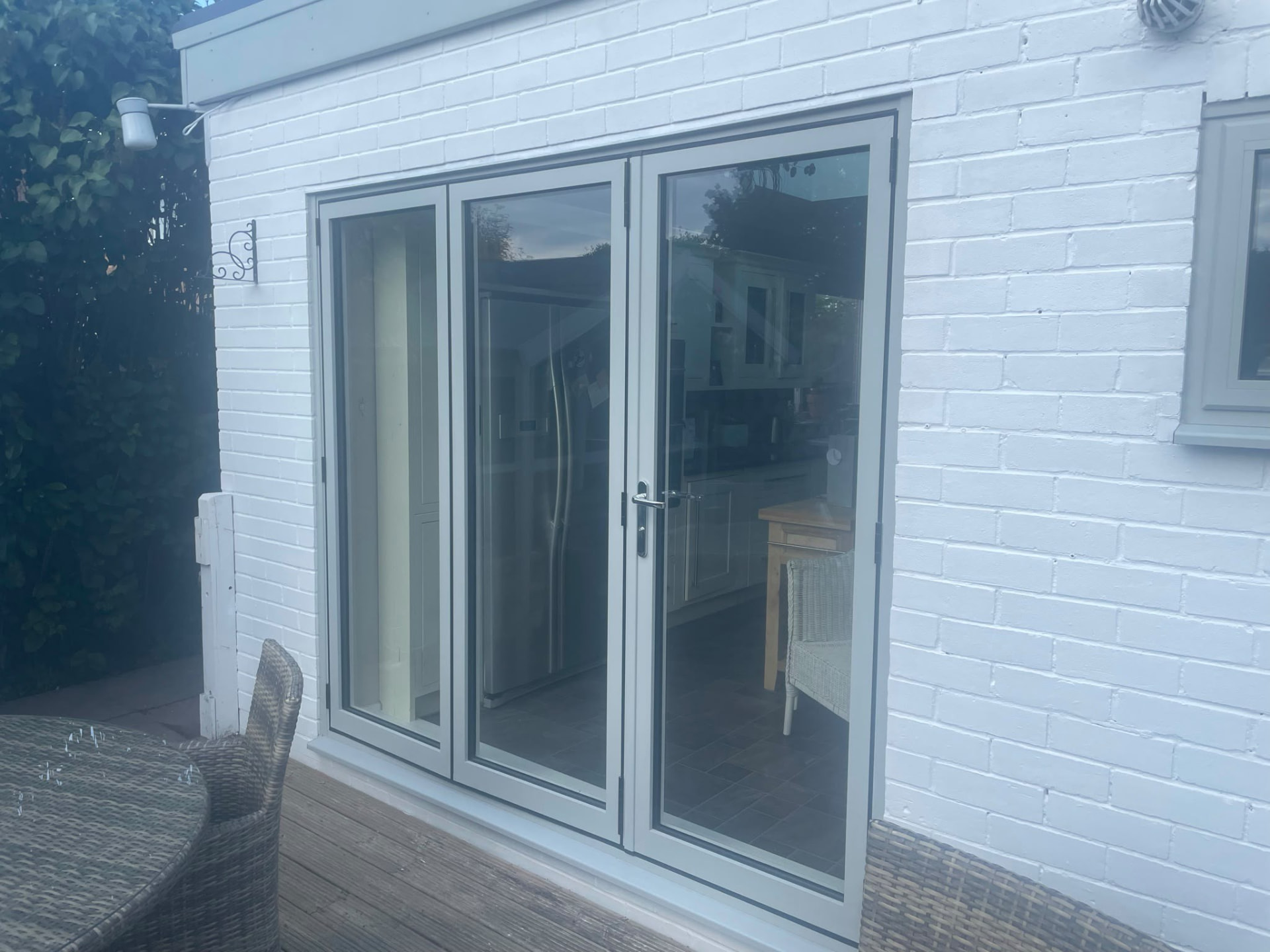 White UPVC French doors fitted to a rear elevation by Draycote Windows