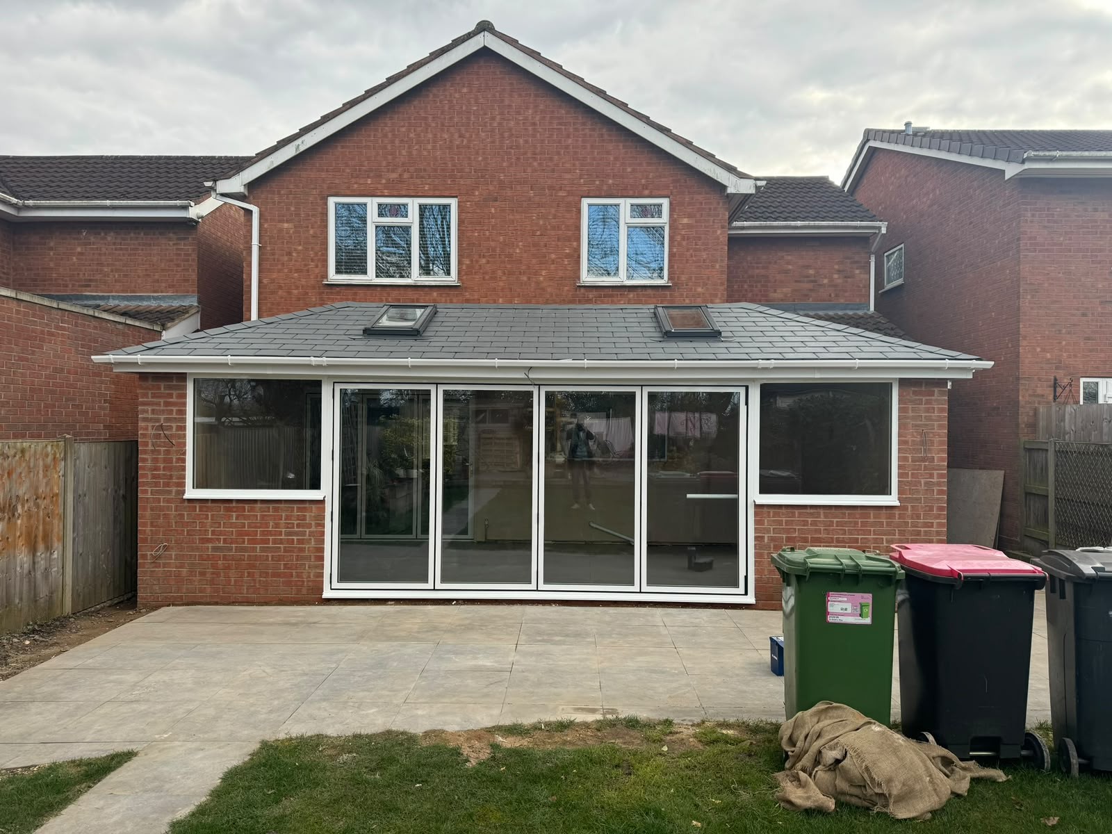 Insulated tiled warm roof on a rear conservatory with white frames