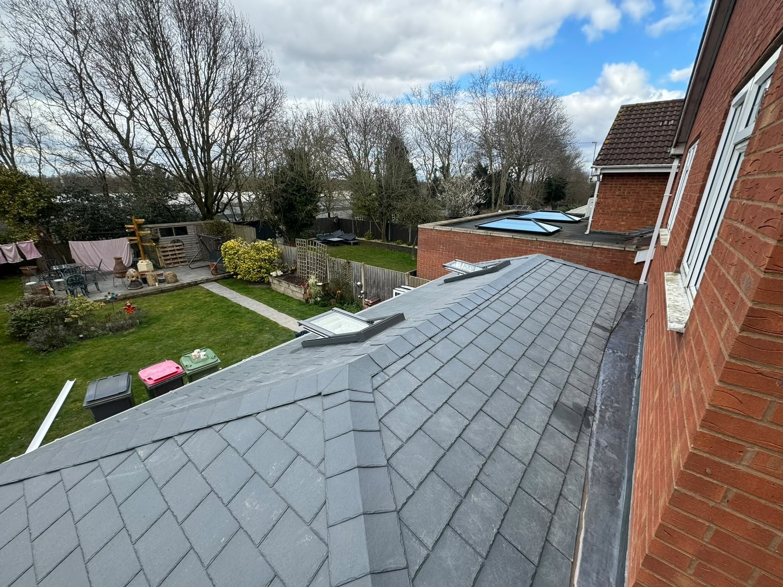 Close view of slate-effect tiles on a newly installed warm roof