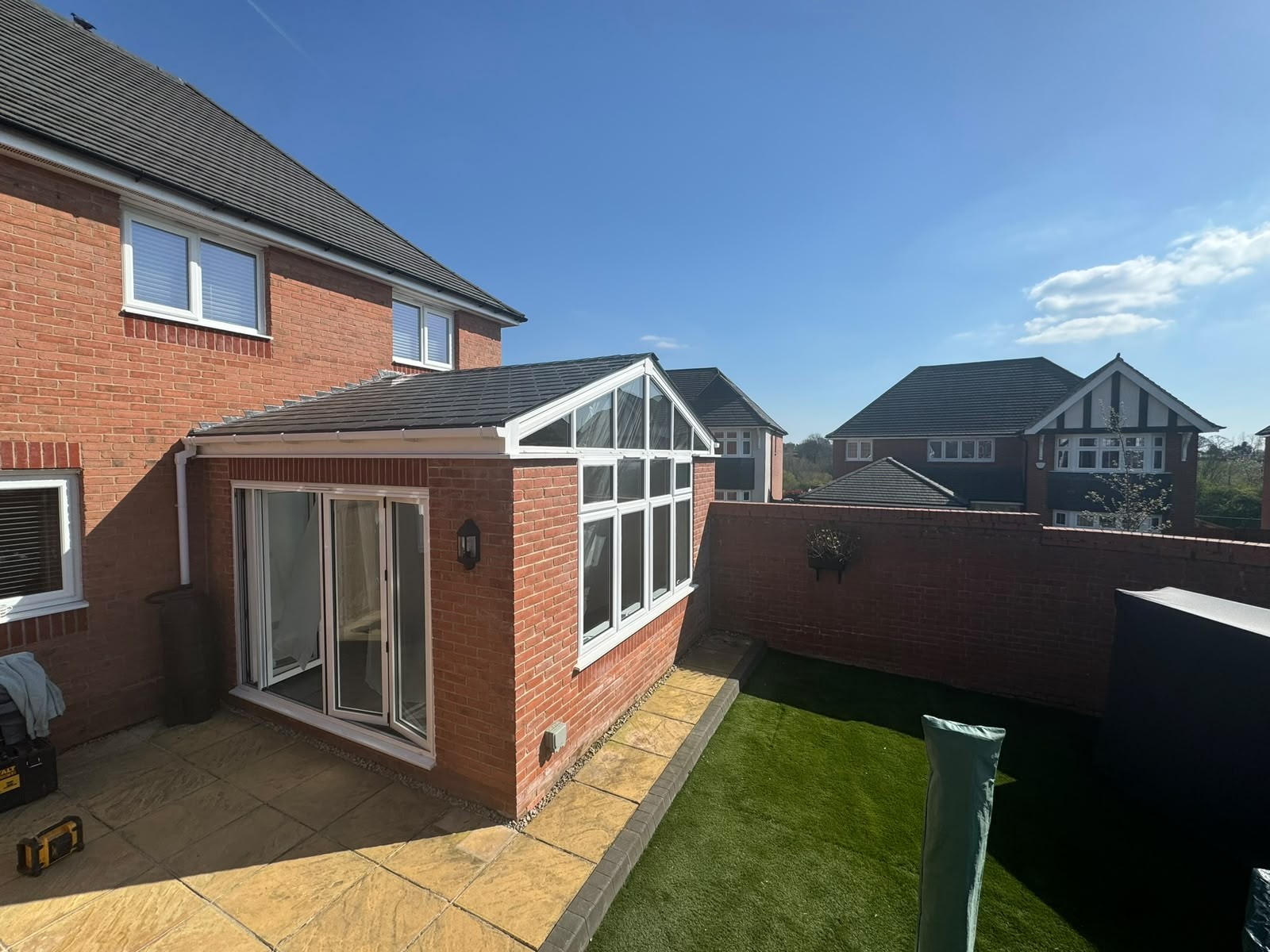 Insulated tiled warm roof replacing a polycarbonate conservatory roof